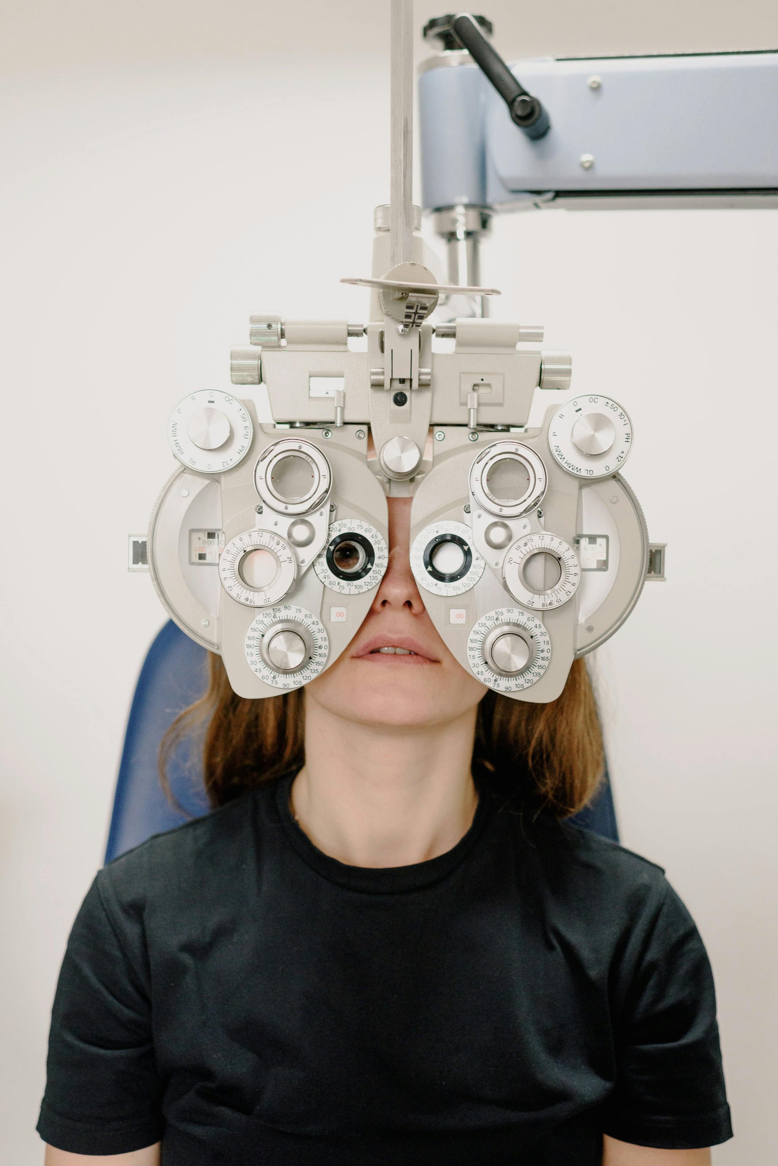 Doctor checking child's eyes